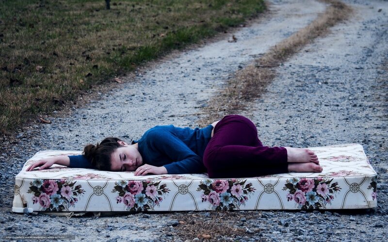 Woman sleeping on a mattress