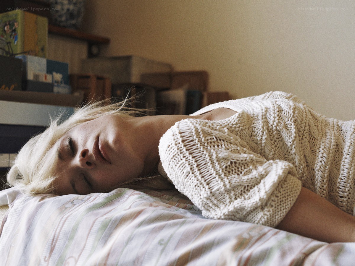 woman sleeping on bed