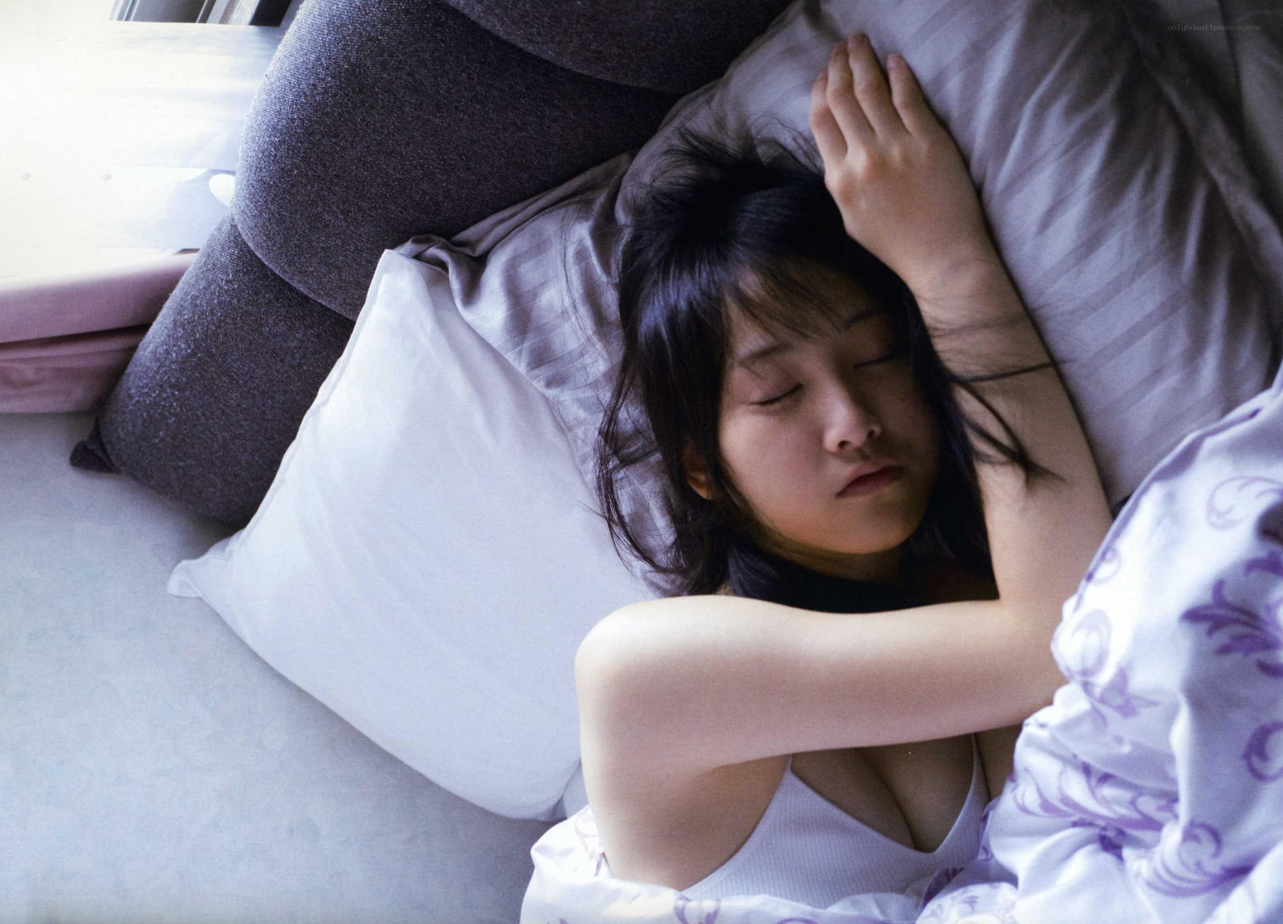 woman sleeping on bed