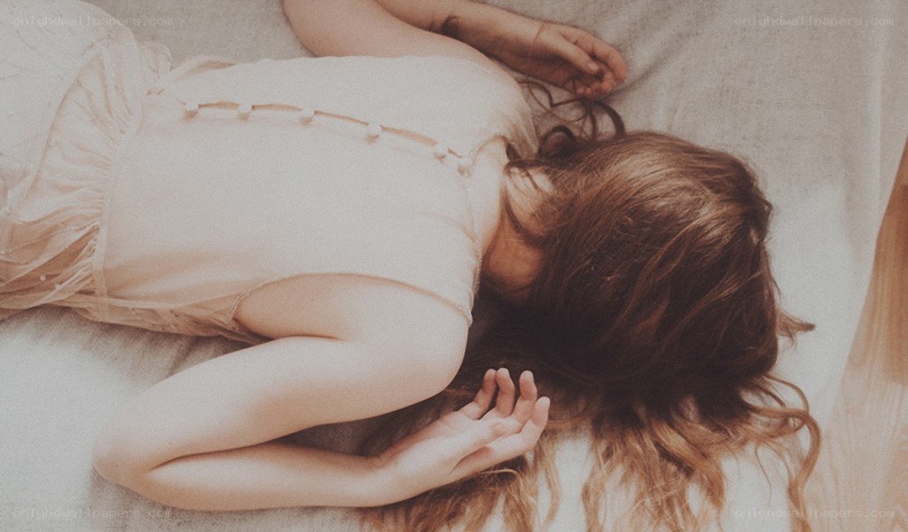 woman sleeping on bed