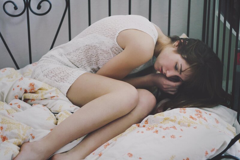 woman sleeping on bed