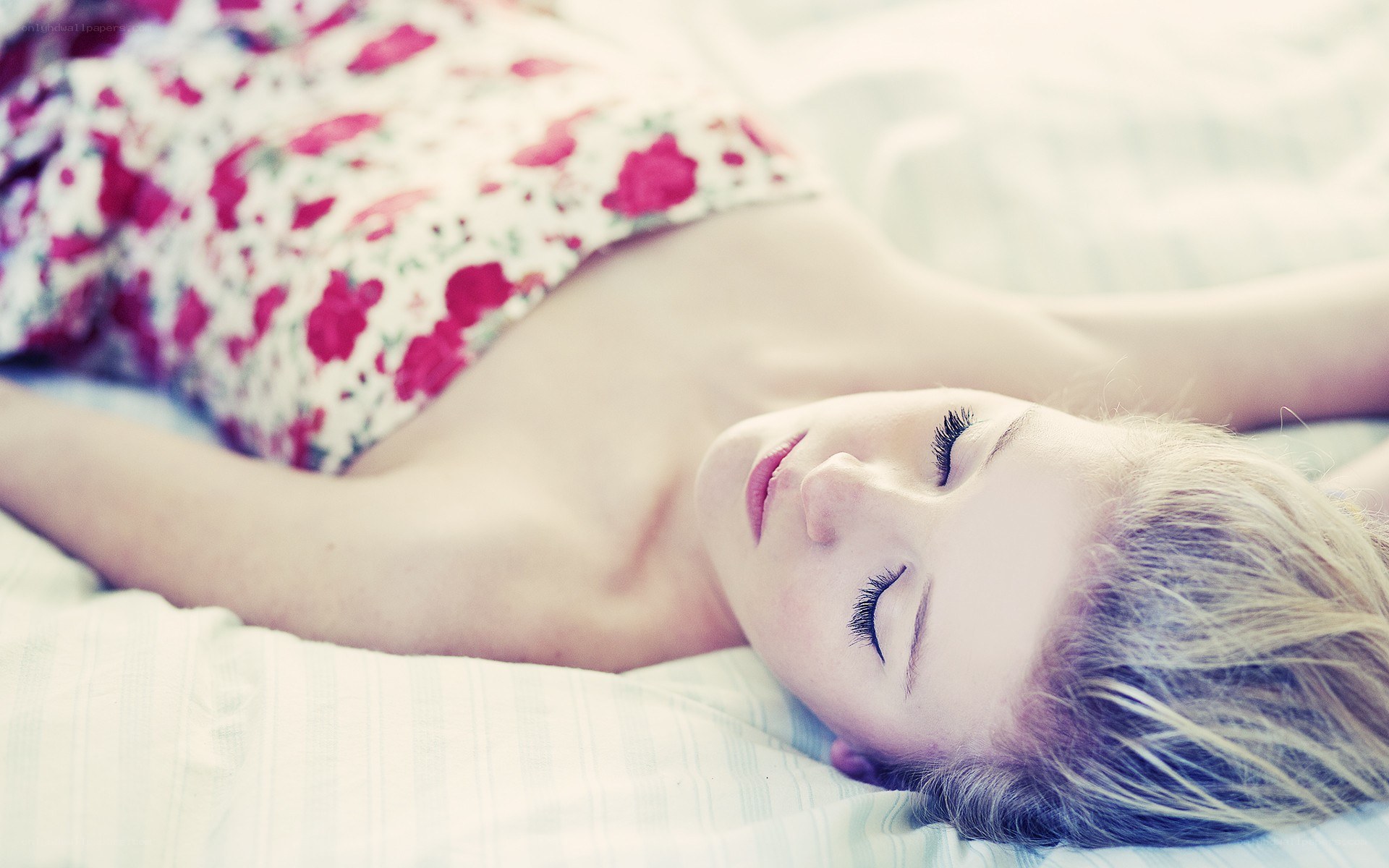 woman sleeping on bed