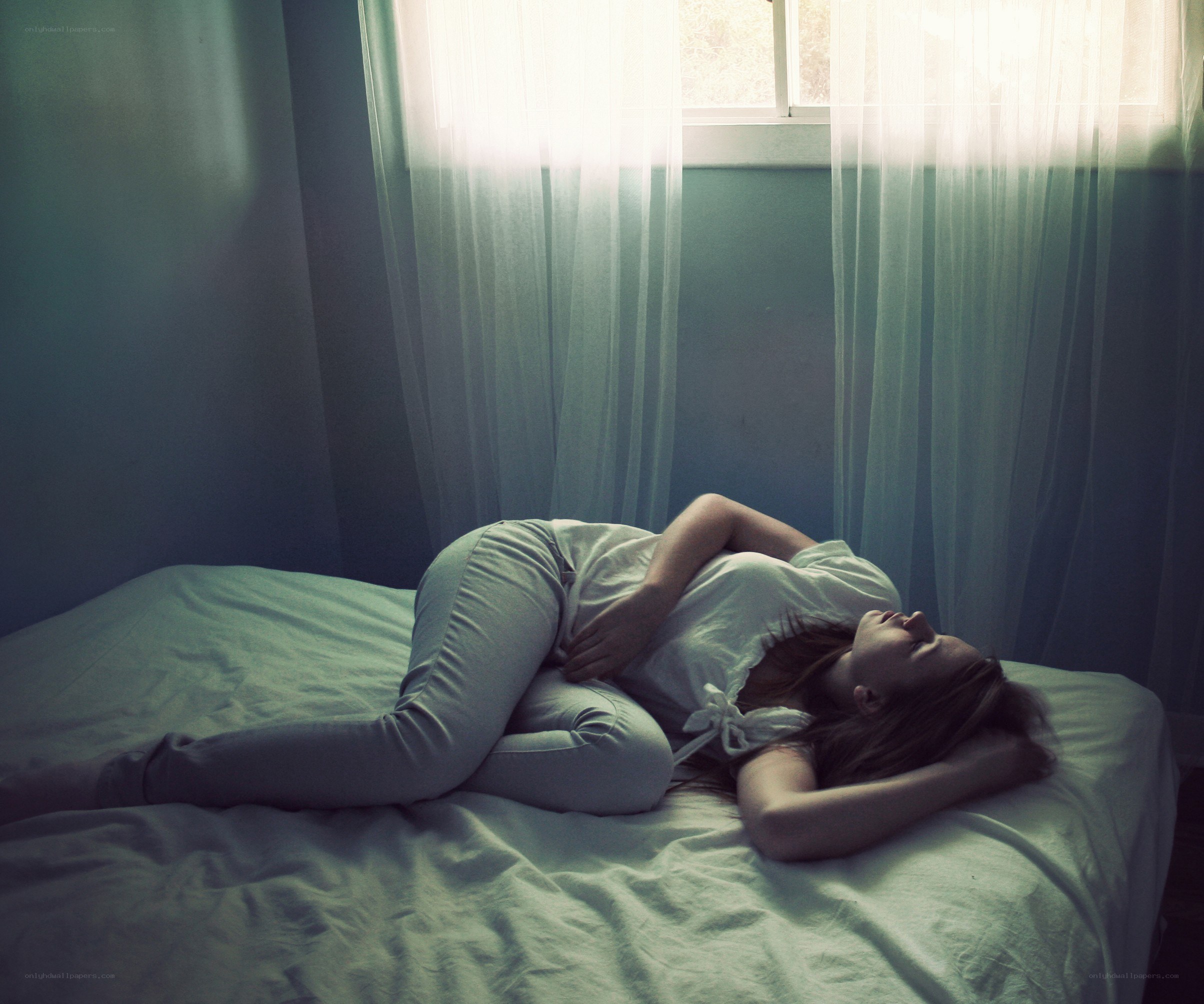 Woman sleeping on bed