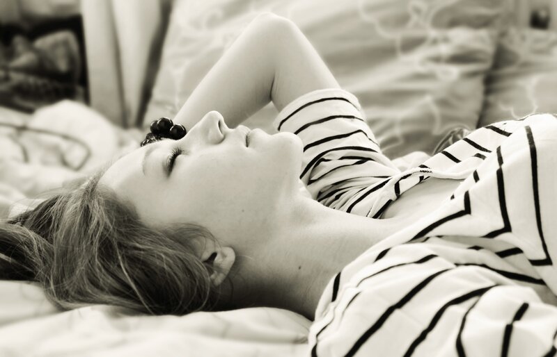 woman sleeping on bed