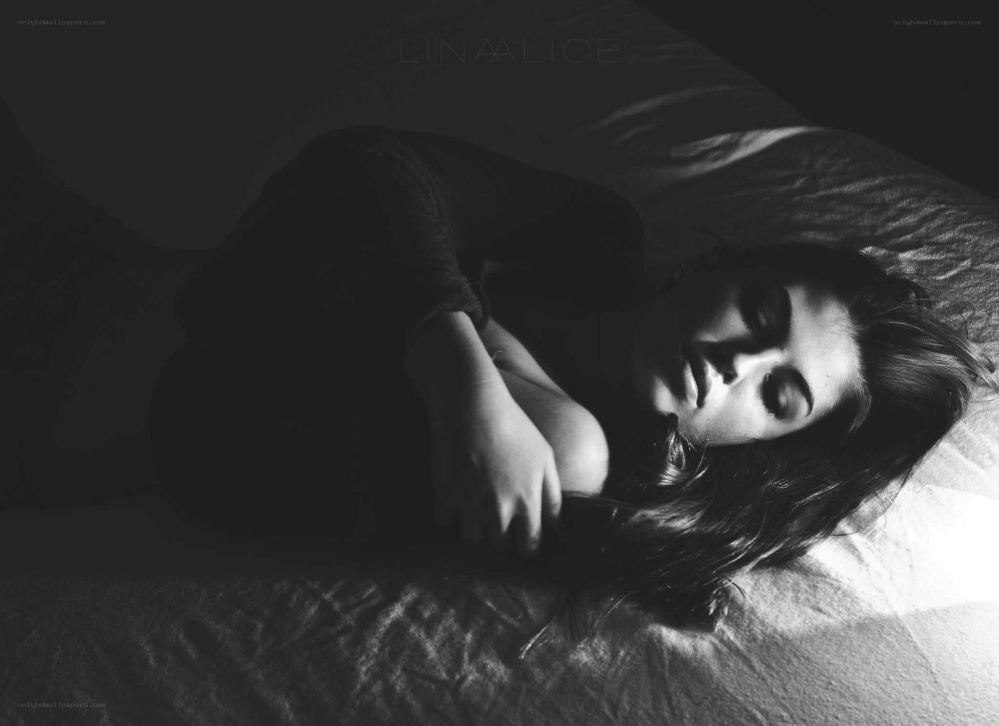 woman sleeping on bed