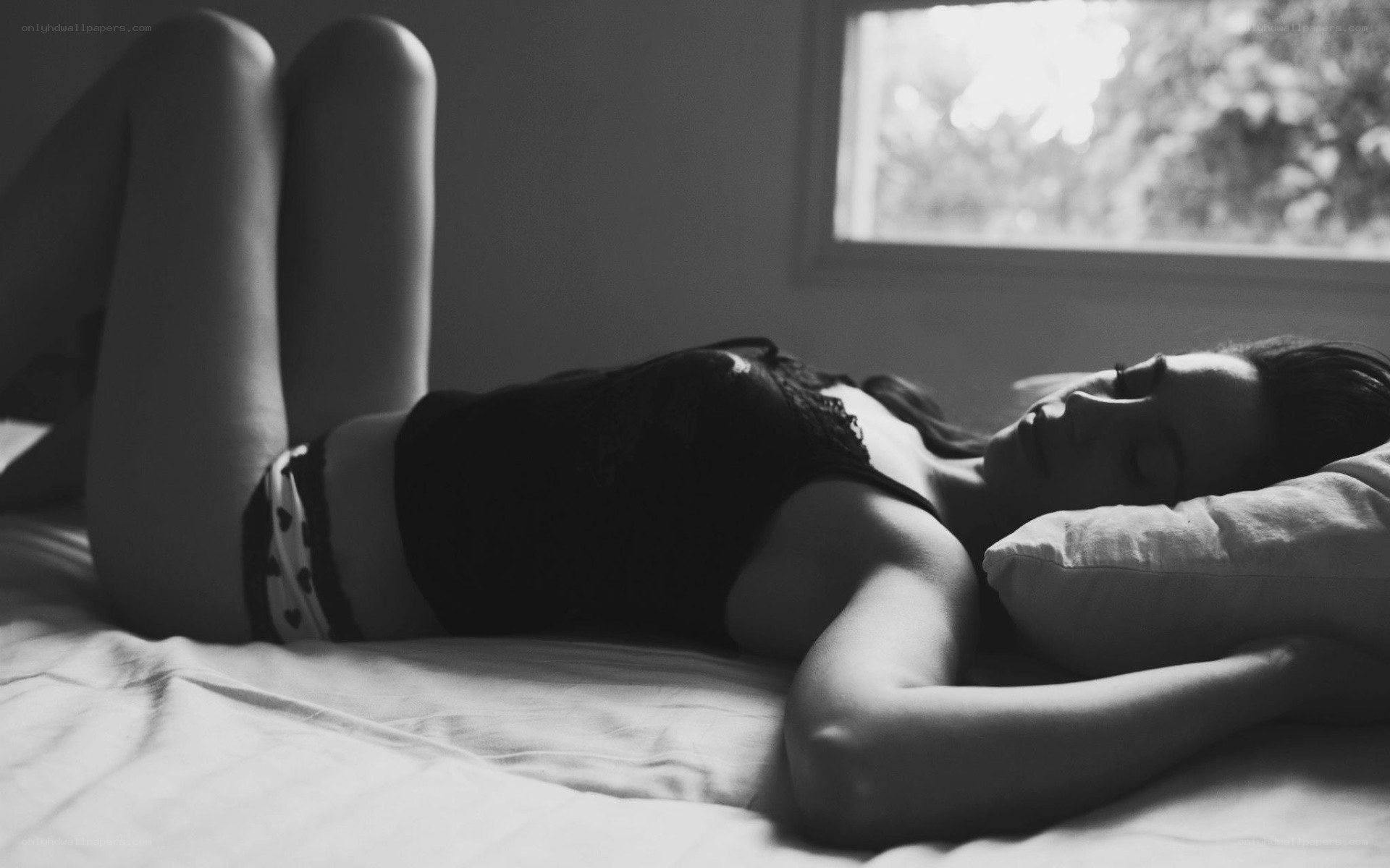 woman sleeping on bed