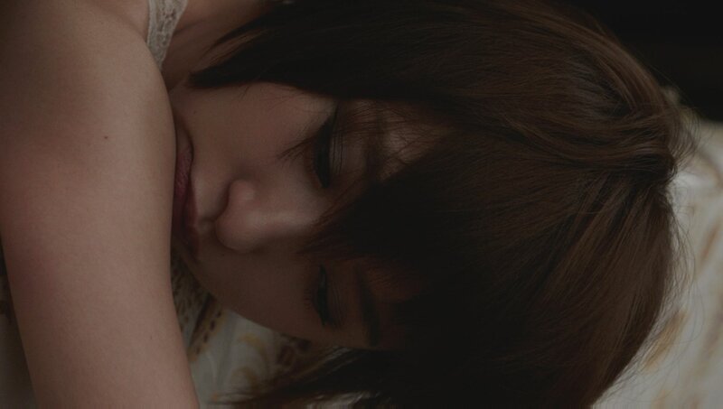 woman sleeping on bed