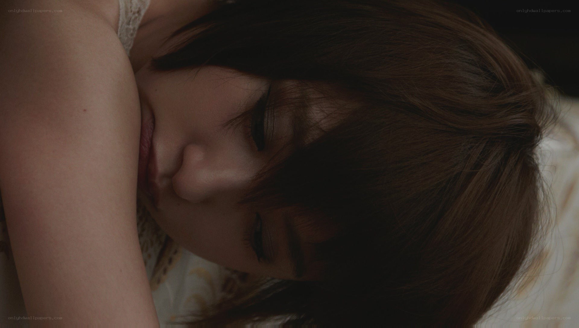 woman sleeping on bed