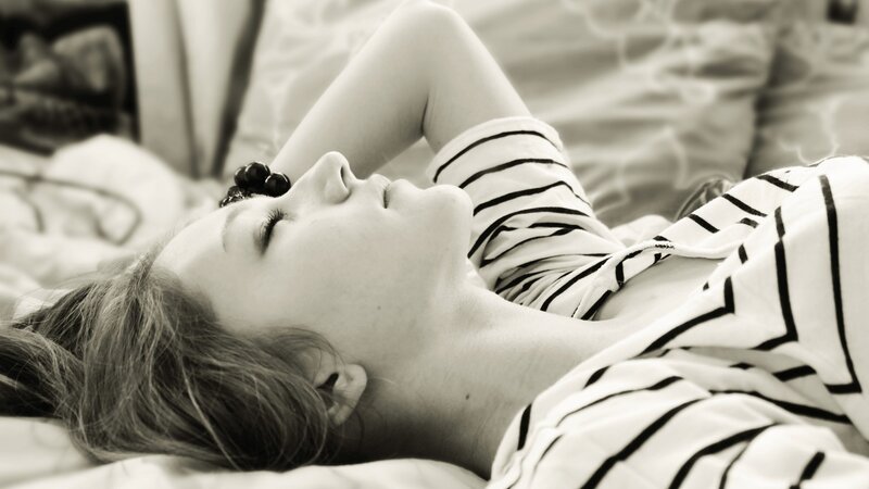 Woman Sleeping on Bed — Photograph