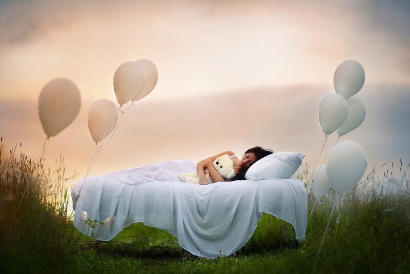 Woman Sleeping on Bed — White, Serene, Sunset