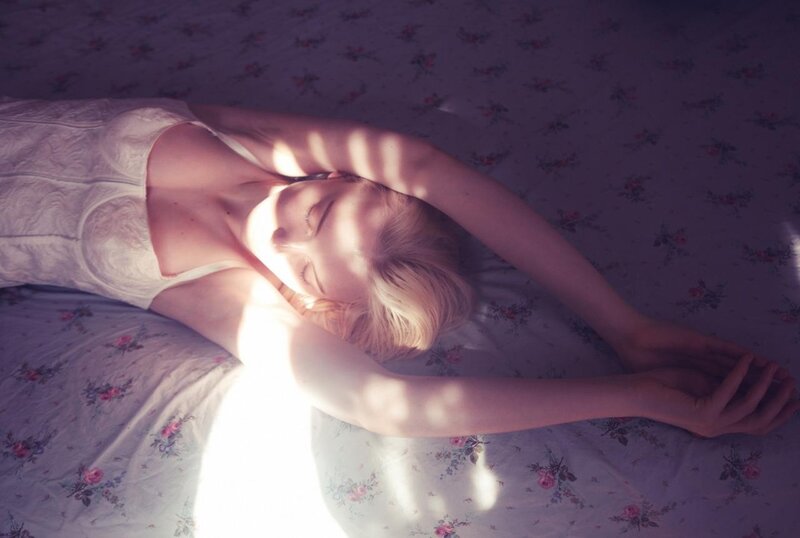 woman sleeping on floral bed