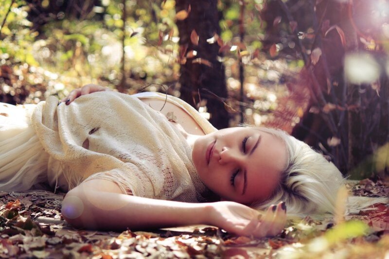 Woman Sleeping on Ground — White, Serene