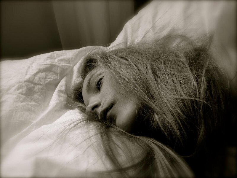 woman sleeping on pillow