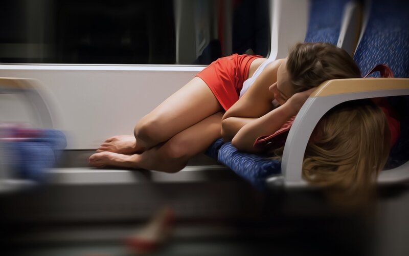 Woman sleeping on train