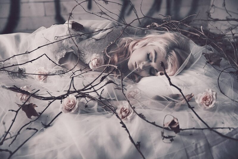 Woman Sleeping on White Fabric