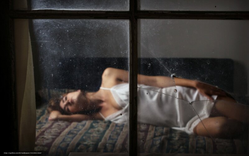 woman sleeping through window