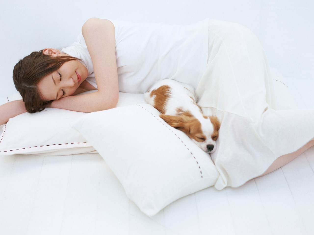 Woman sleeping with dog