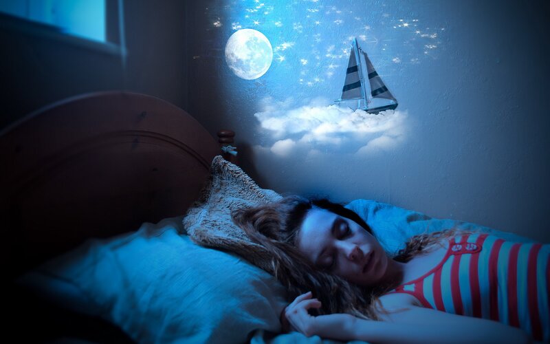woman sleeping with dream projection