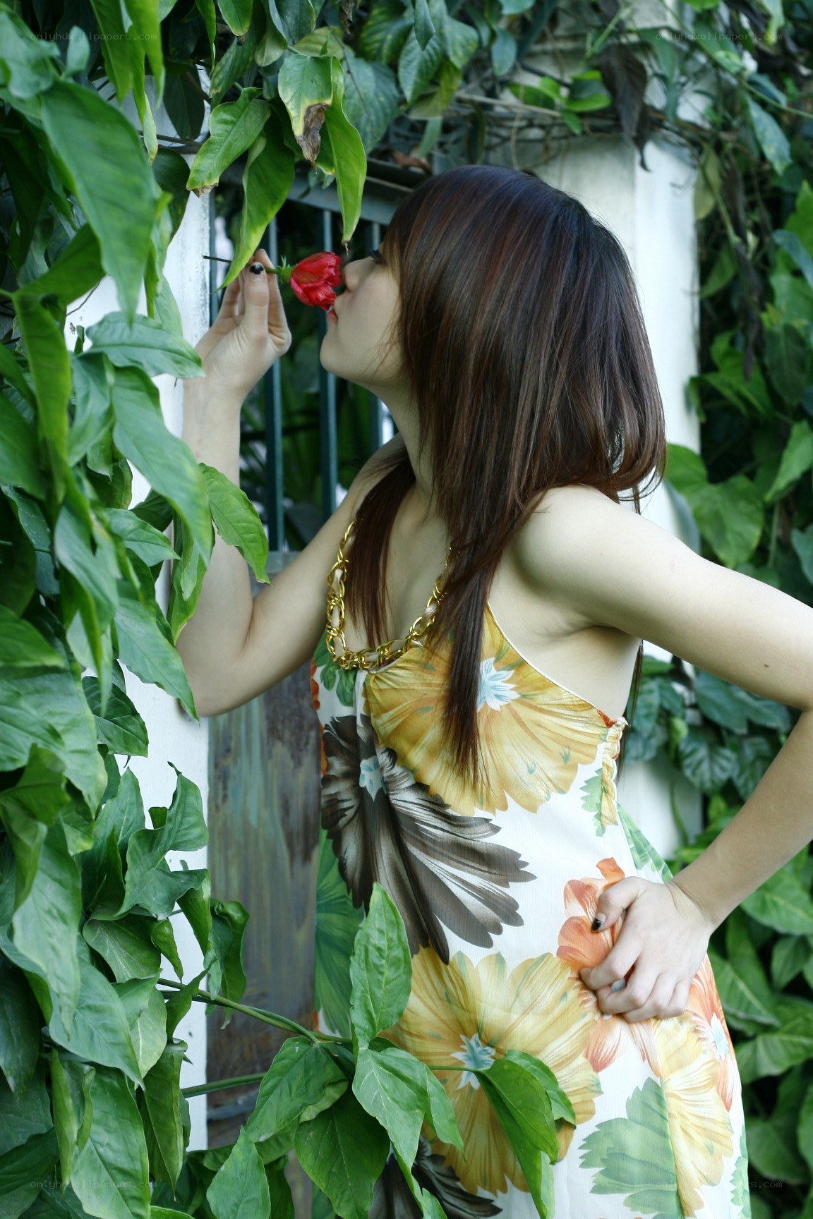 woman smelling a flower