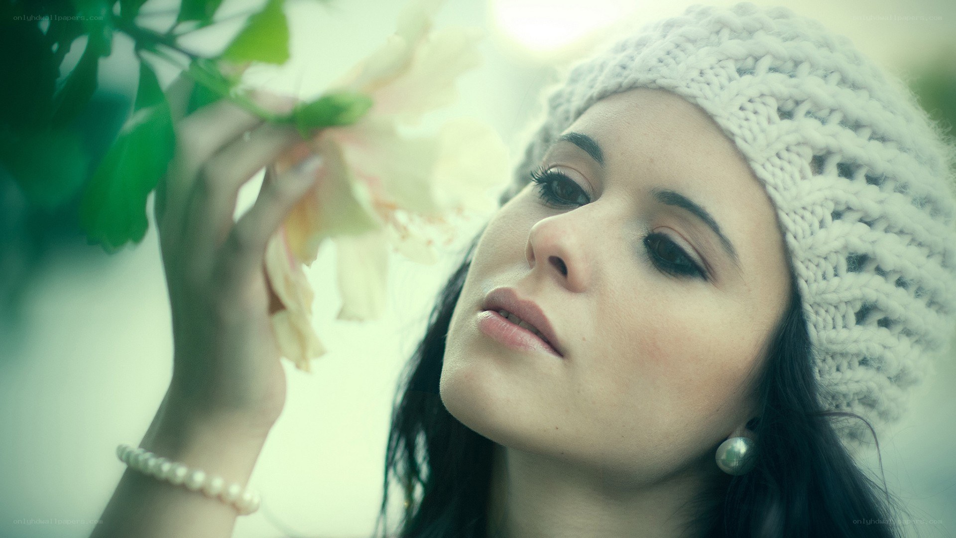 woman smelling a flower