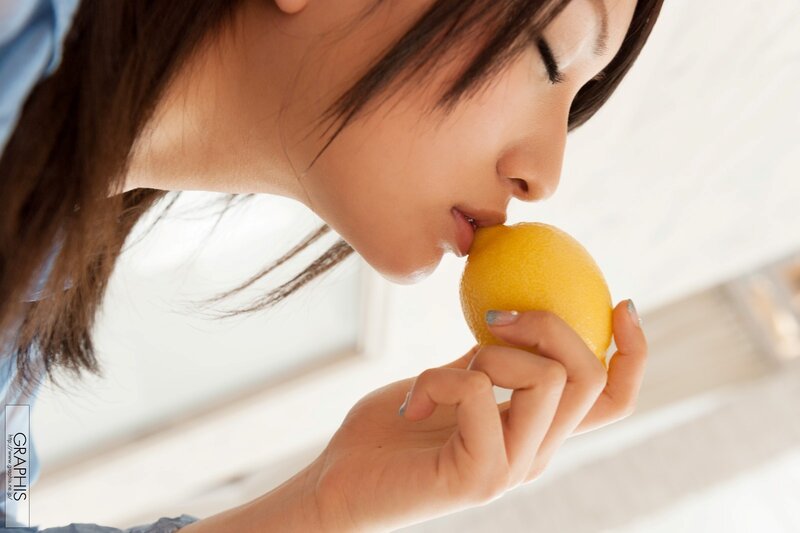 woman smelling a lemon