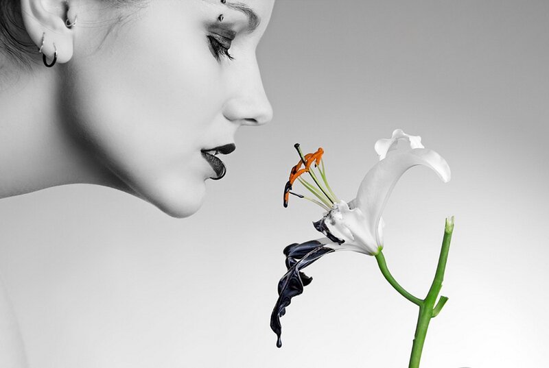 woman smelling a lily