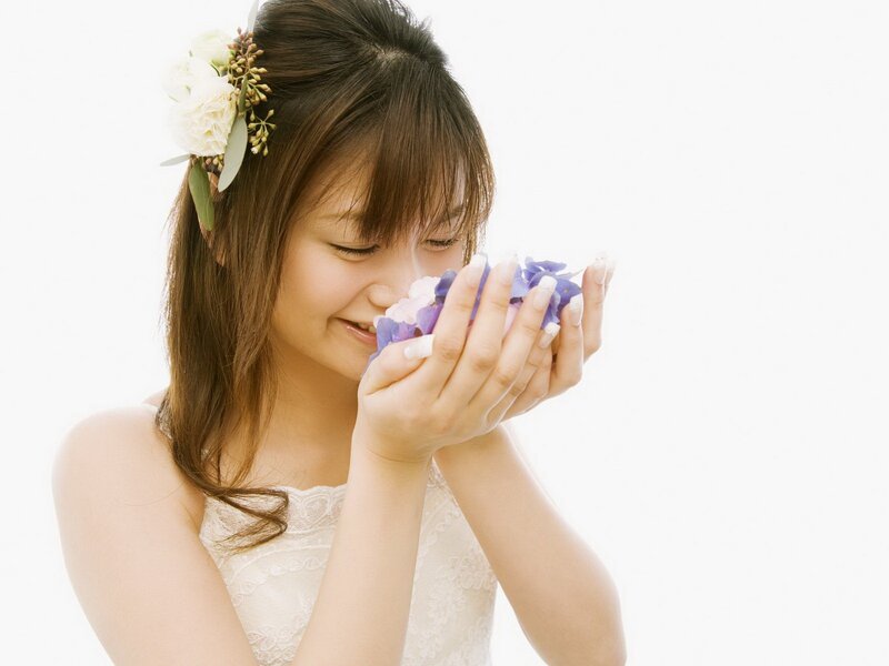 woman smelling flowers