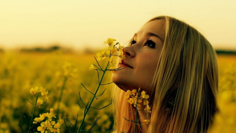 Woman Smelling Flowers — Yellow