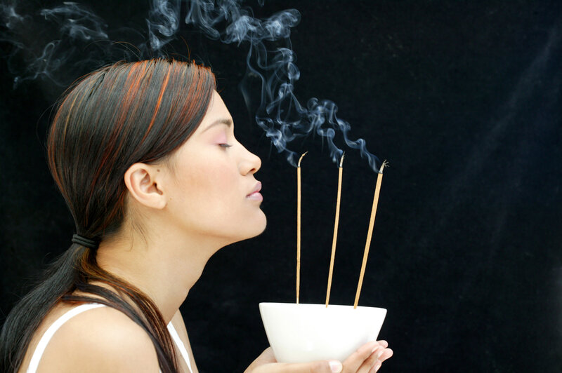 Woman Smelling Incense