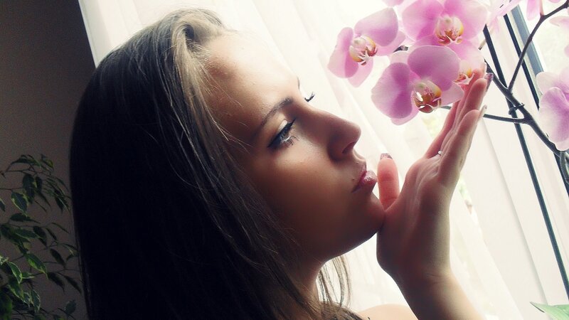 Woman Smelling Orchid — Pink