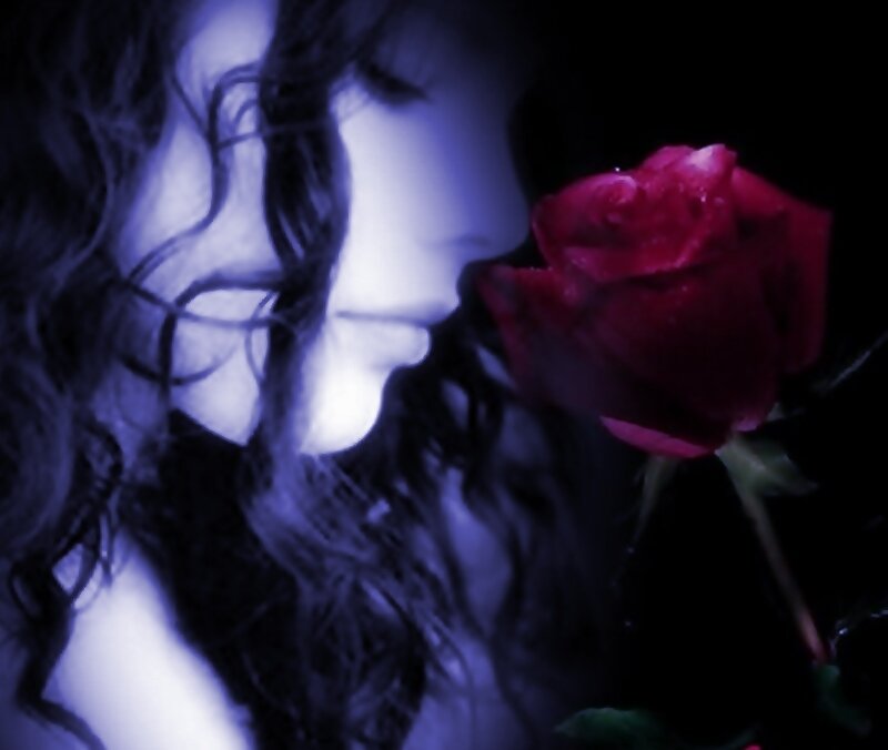 Woman Smelling Rose