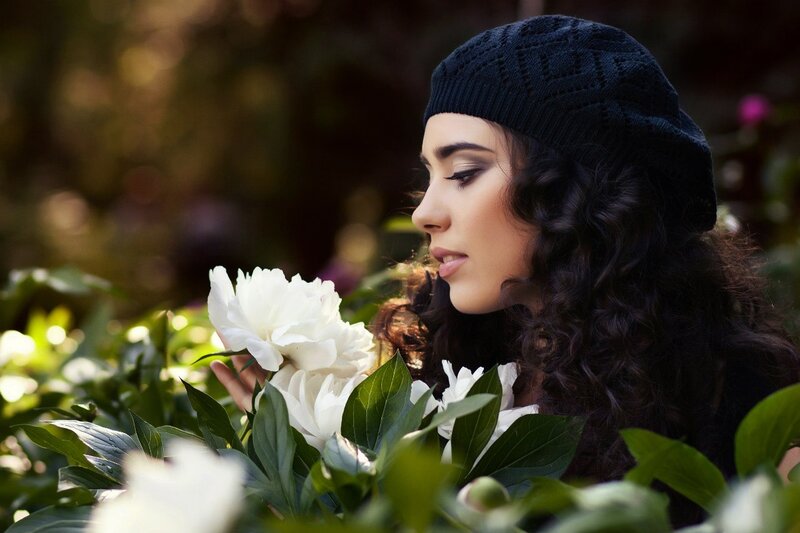 Woman Smelling White Peony
