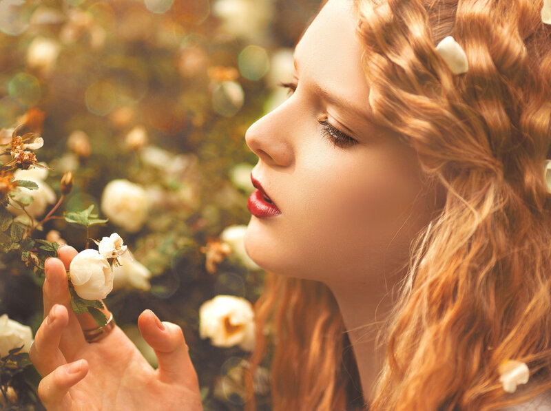 Woman Smelling White Rose — Golden