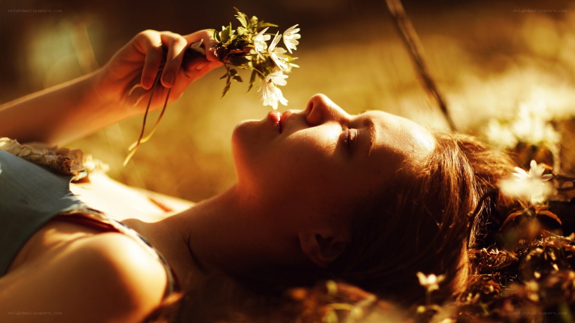 woman smelling wildflowers