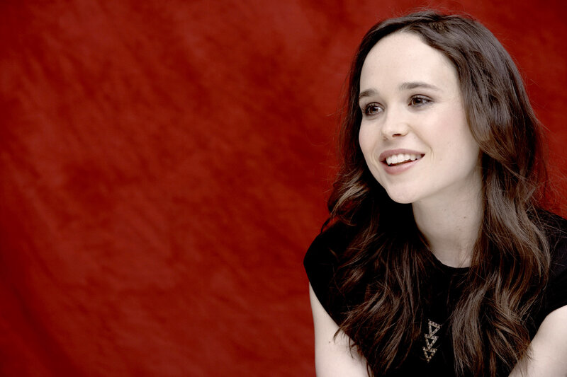 woman smiling against red background