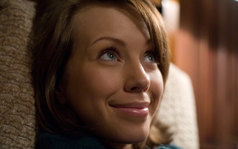 woman smiling and looking up