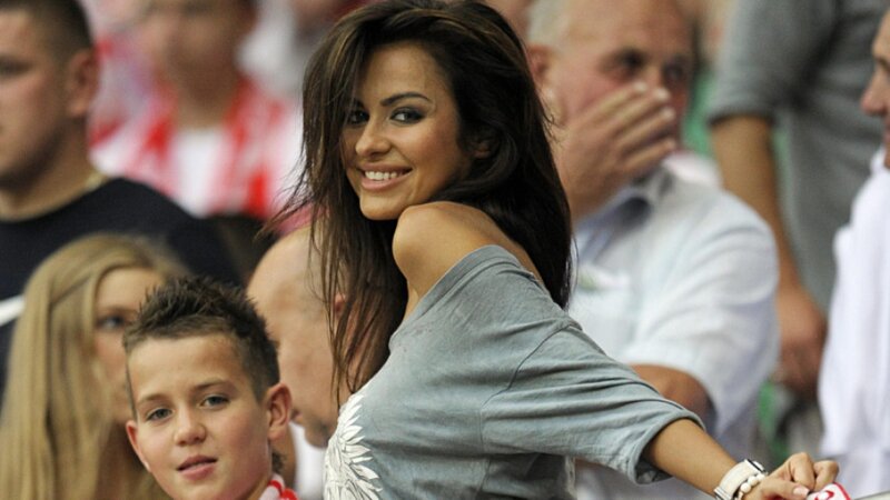 Woman smiling at a stadium