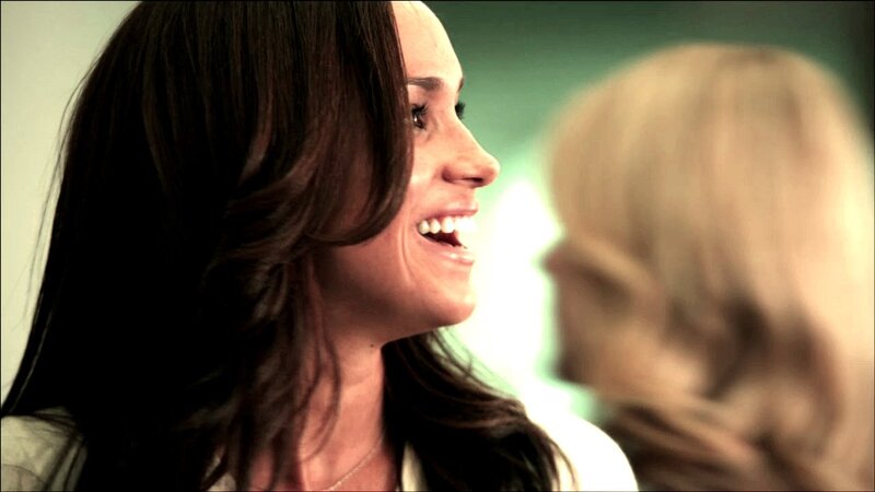 woman smiling at another person