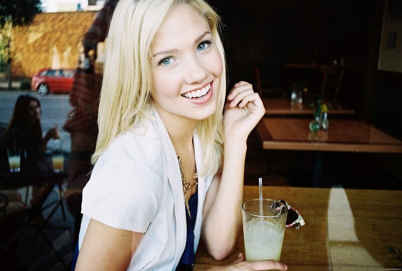 woman smiling at cafe