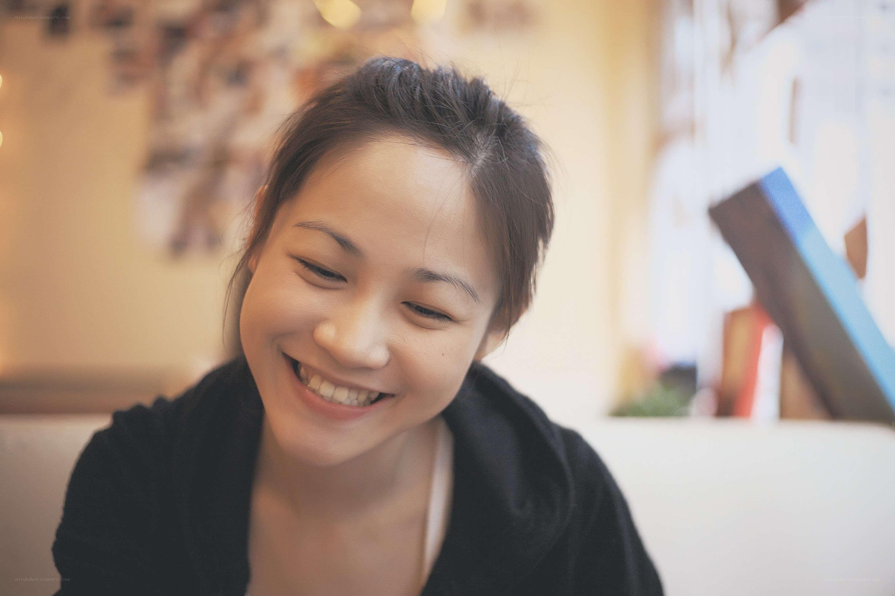 woman smiling at cafe
