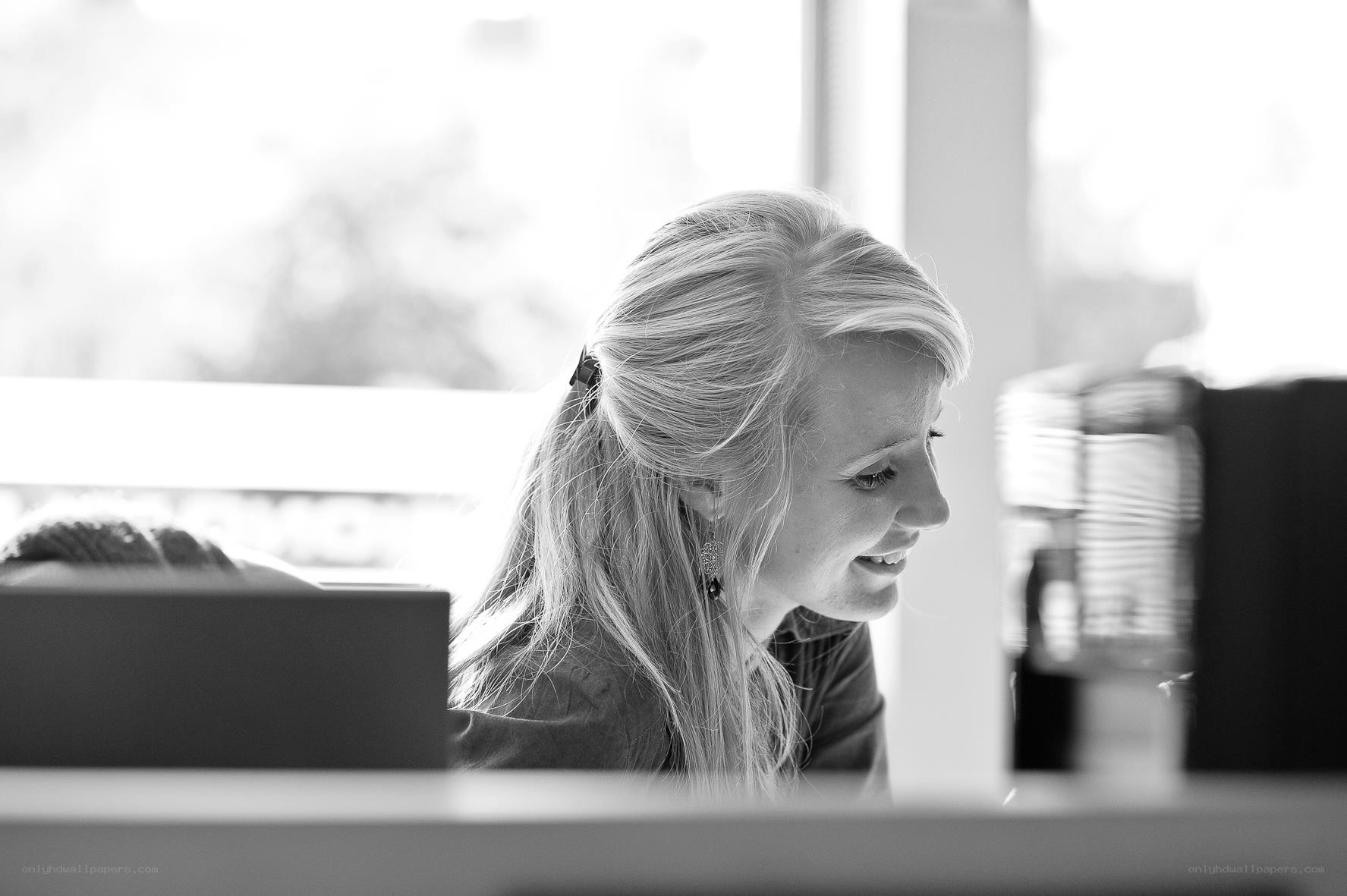 woman smiling at computer