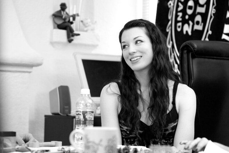 woman smiling at desk