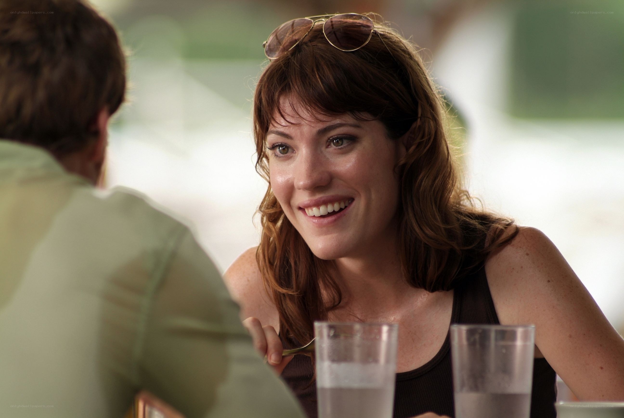 woman smiling at dinner