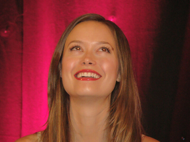 woman smiling at event