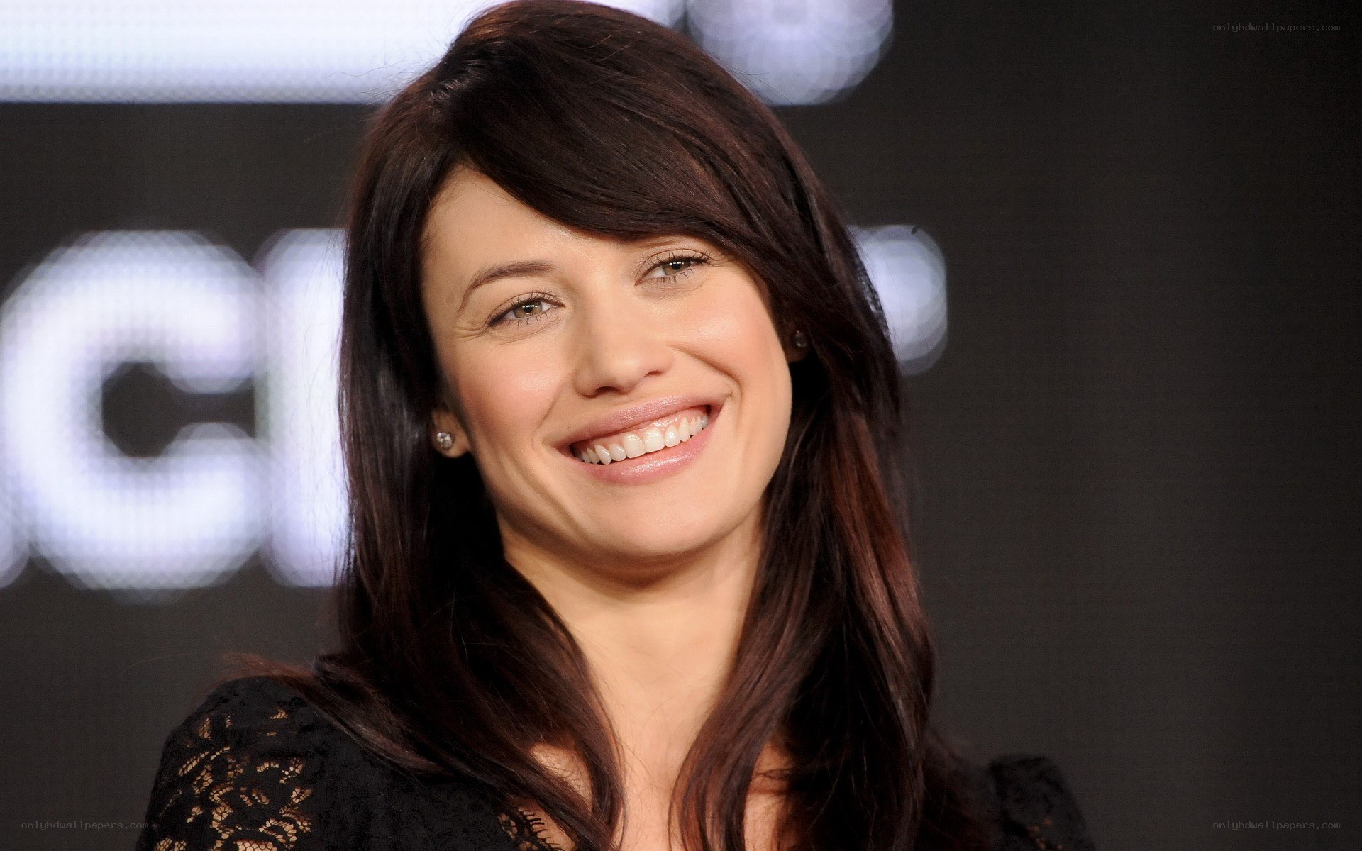 woman smiling at event