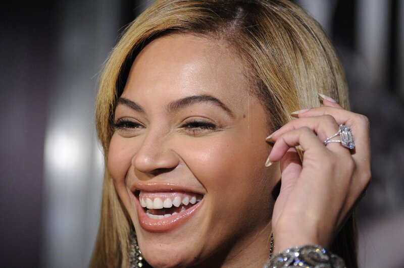 Woman Smiling at Event — Brown, Joyful