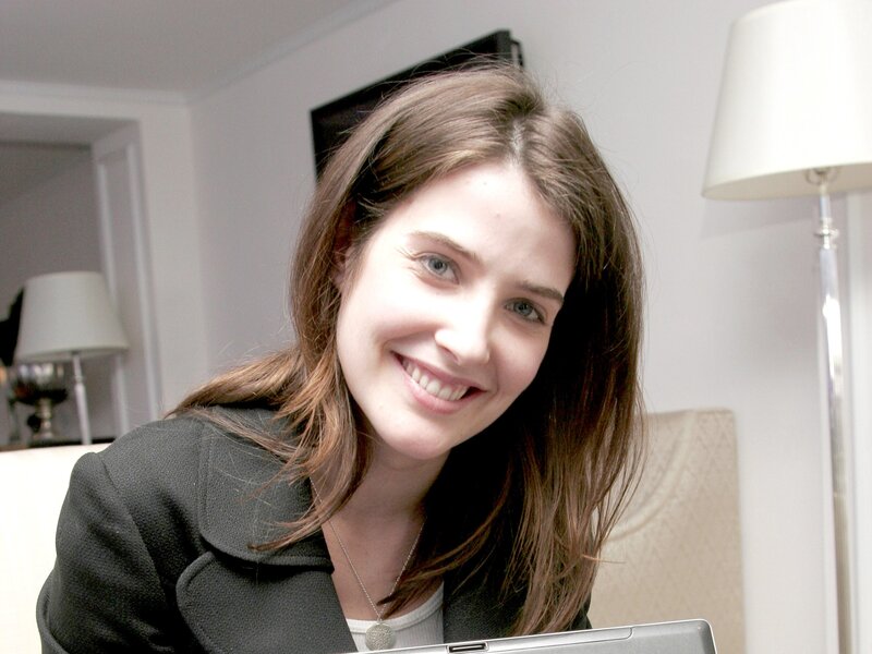 woman smiling at laptop