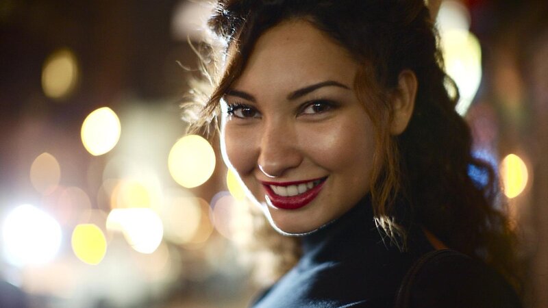 woman smiling at night