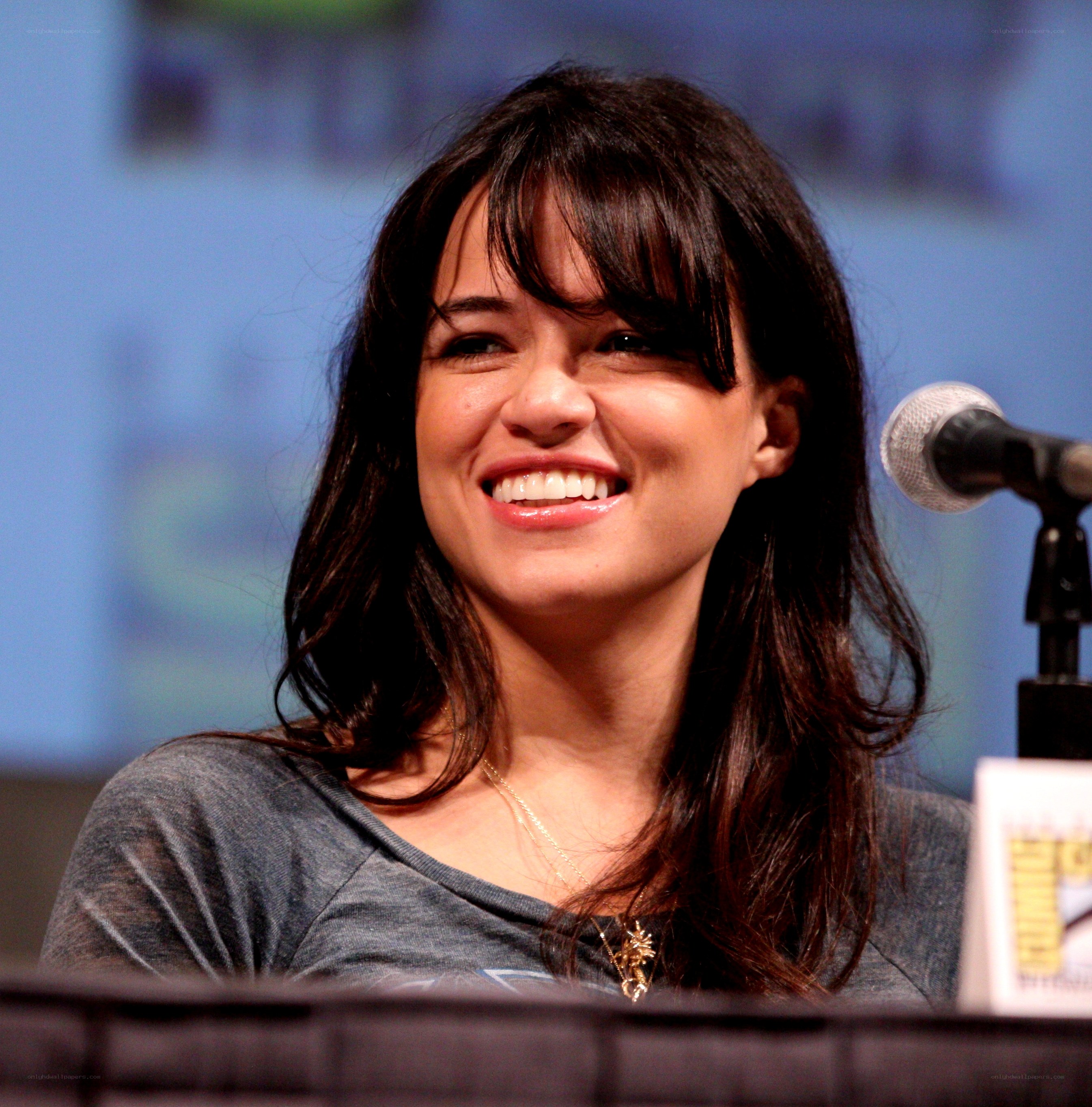 woman smiling at panel