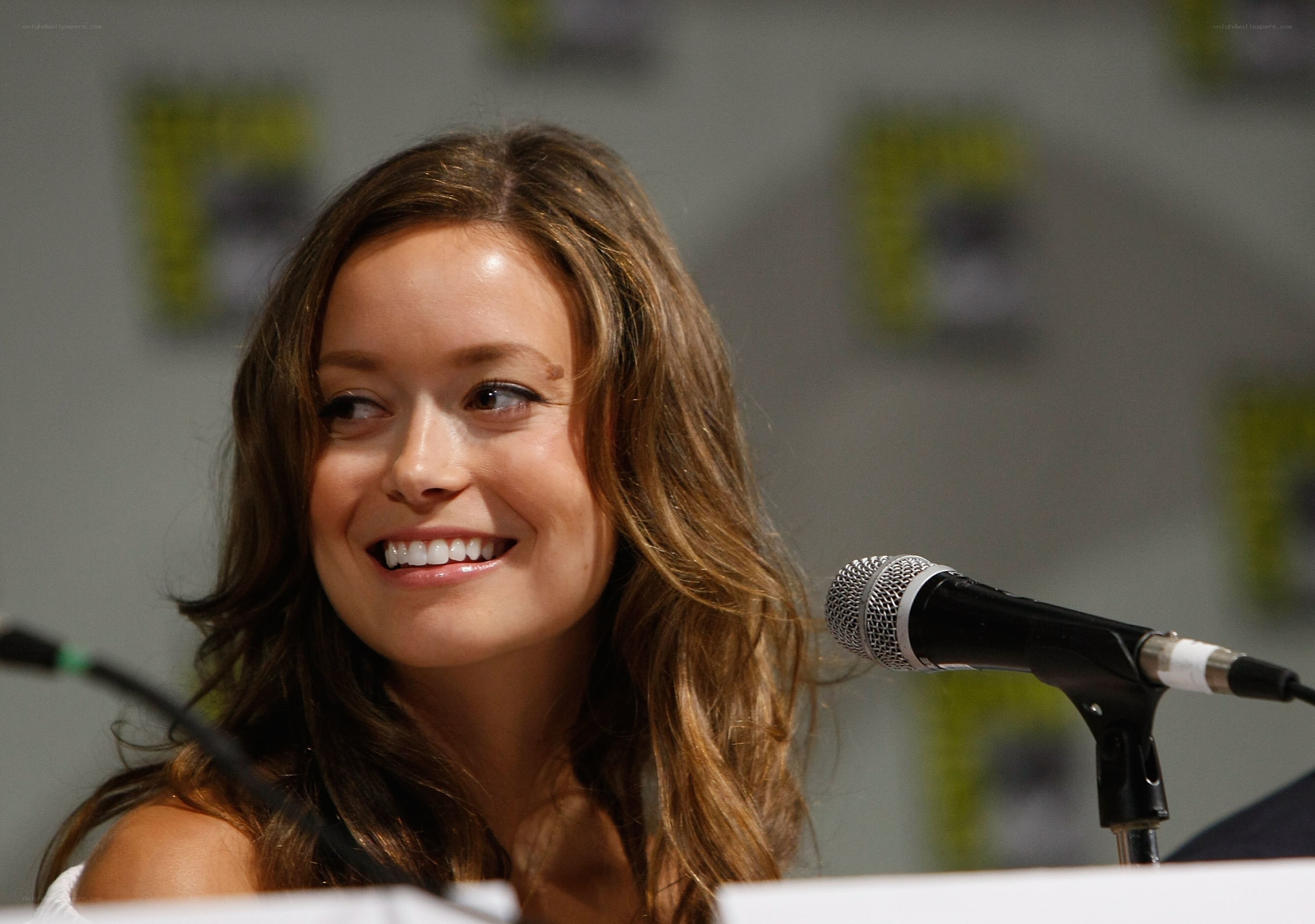 woman smiling at panel